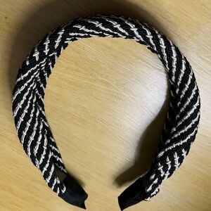 Black and White Braided Headbandwith silver metallic accents.